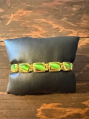 Gold Tone Plated Magnetic bracelet with green cat's eye stones